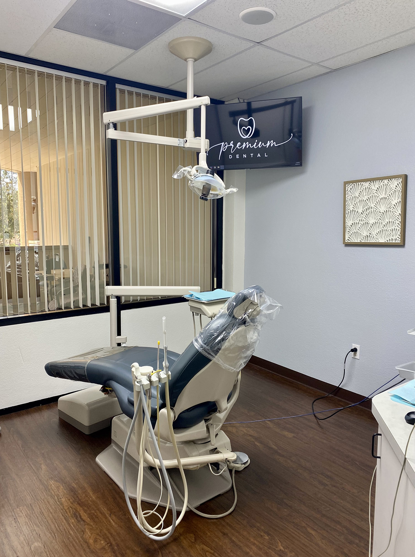 The image shows an interior view of a dental office equipped with dental chairs and equipment, likely for dental procedures.